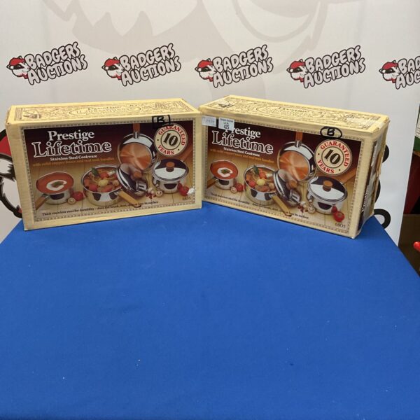 Two boxes of vintage Prestige Lifetime stainless steel cookware.