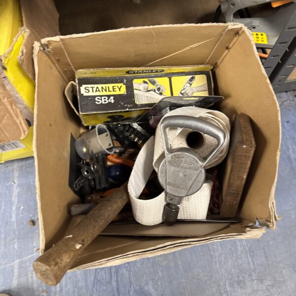 Vintage tool lot with a hand drill and assorted tools.