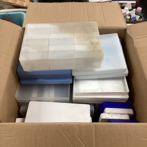 Assorted plastic storage cases in a mixed lot.
