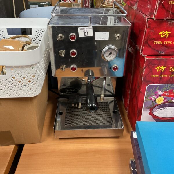 Vintage Isomac coffee machine with stainless steel body and dials.