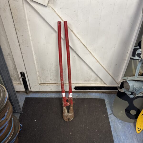 Front view of large industrial bolt cutters showing wear.