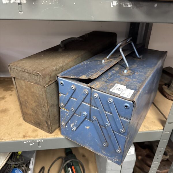 Vintage Skil saw box and metal cantilever toolbox for tool storage.