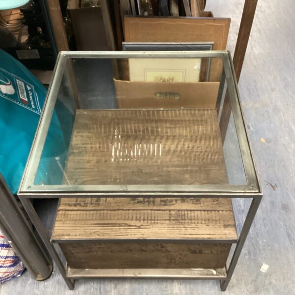 Vintage chrome metal glass top side table for display.