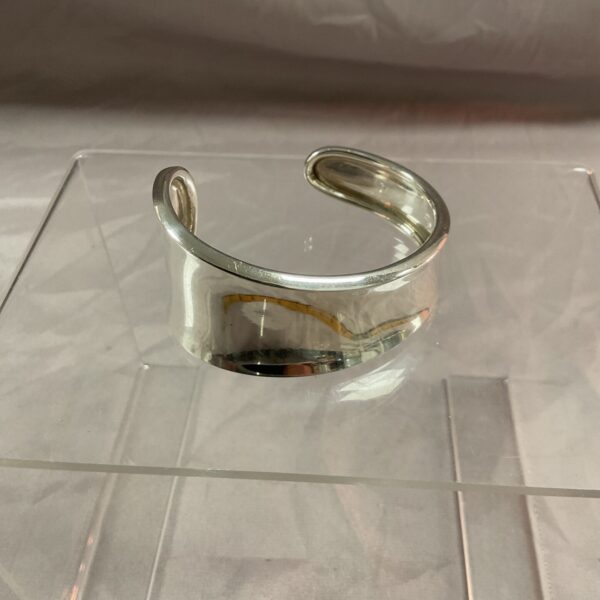 Silver Robert Lee Morris bangle, modernist cuff design.