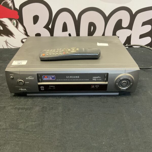 Silver Samsung VCR player with tape deck and controls visible.