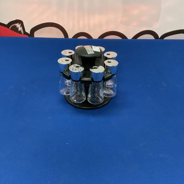 Vintage Cole and Mason spinning spice rack for kitchen storage.