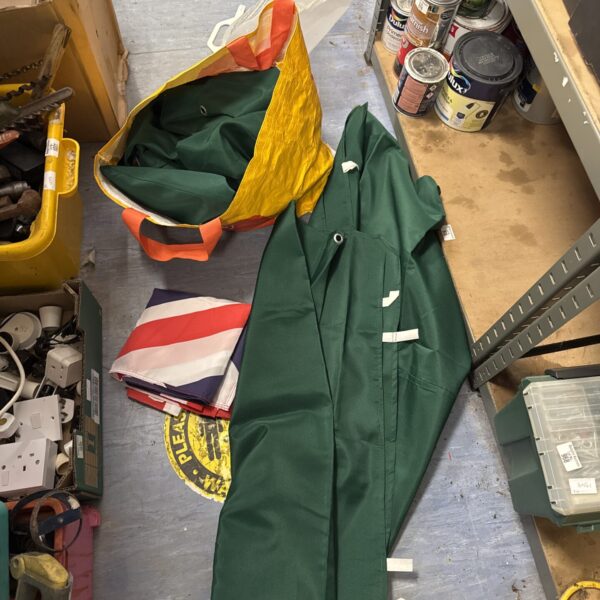 Green canopy sheets and a large Union Jack flag for events.