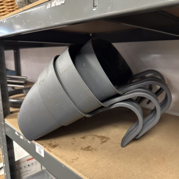 Lot of three dark grey plastic hanging plant troughs for gardening.