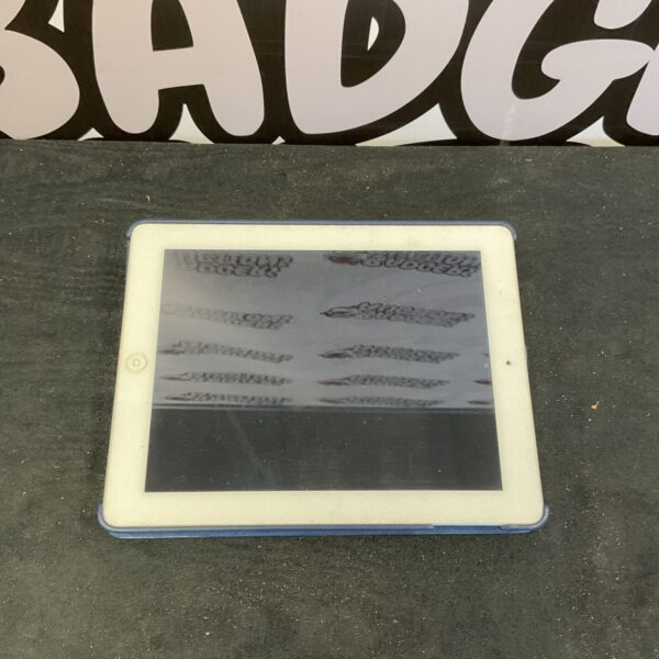 Apple iPad A1475 with protective case, vintage tablet device.