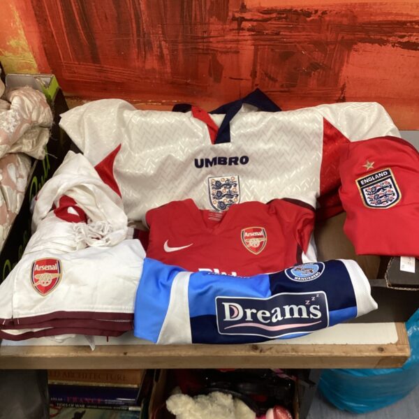 Children's football shirts bundle including England, Arsenal and Wycombe.