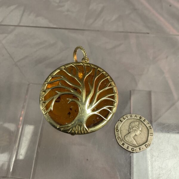 Vintage silver gilt brooch with amber tree of life design.