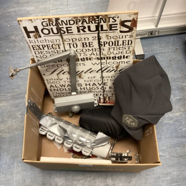 Vintage "Grandparents House Rules" sign with door closer and travel pillow.