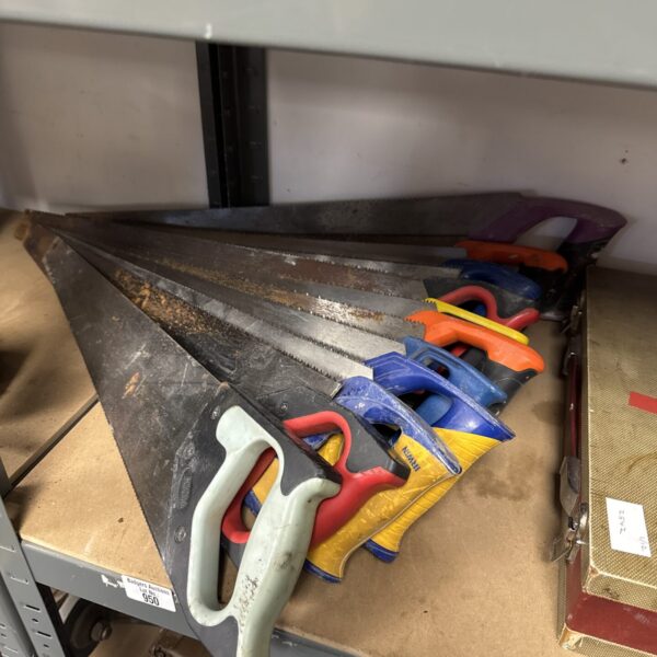 Vintage hand saws including a Spear & Jackson model for woodworking.