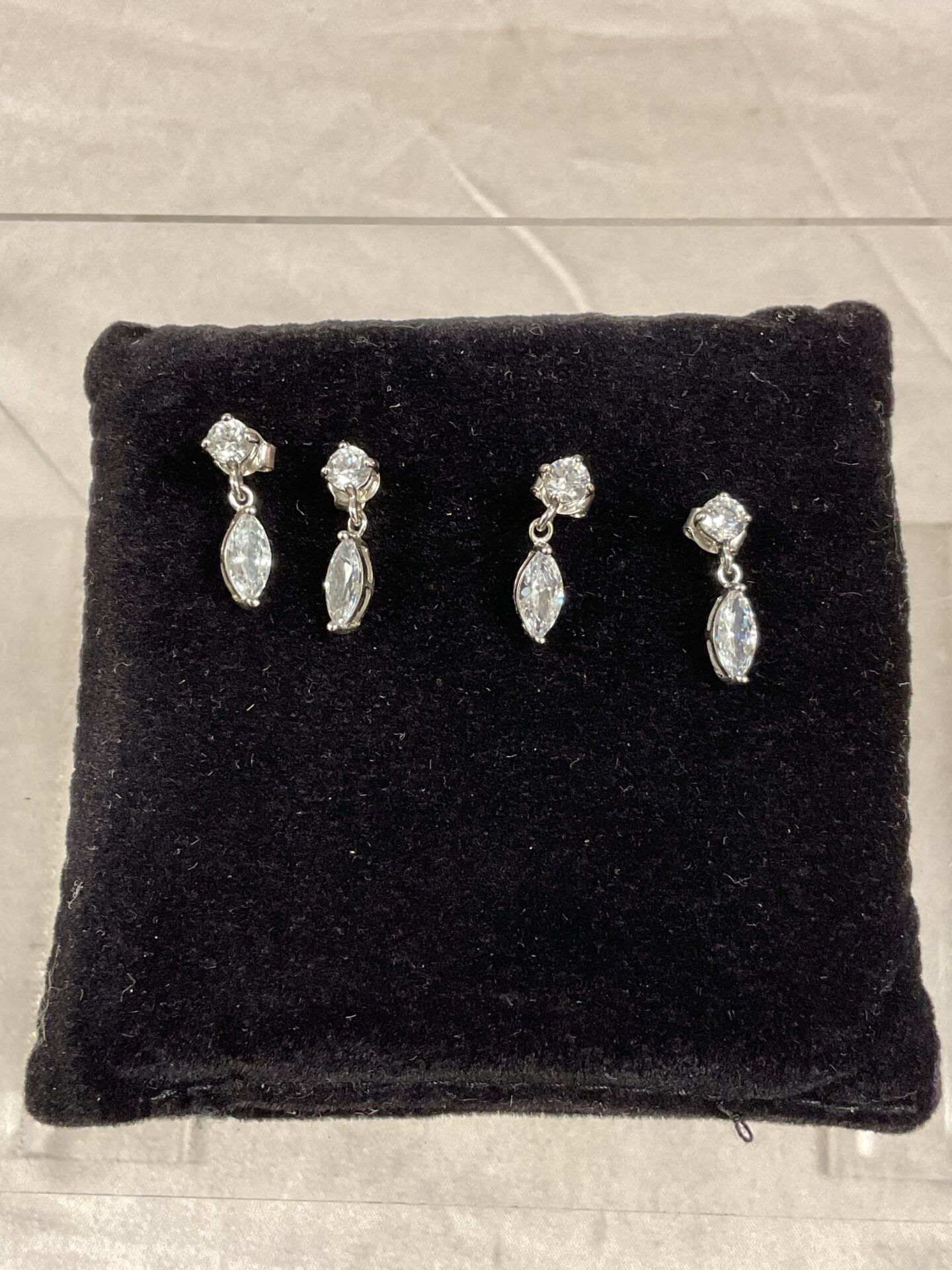 780 Two Pairs of 925 Silver stud earrings set with white stones