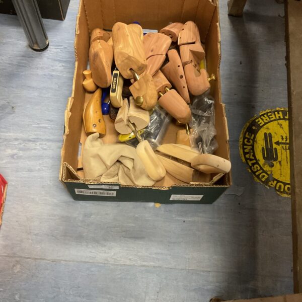 Lot of vintage wooden shoe stretchers for maintaining shoe shape.