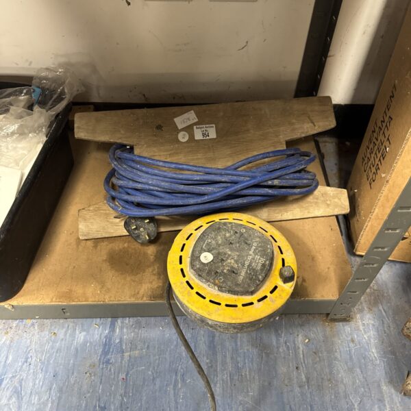 Two extension cables, one blue and one on a yellow reel.