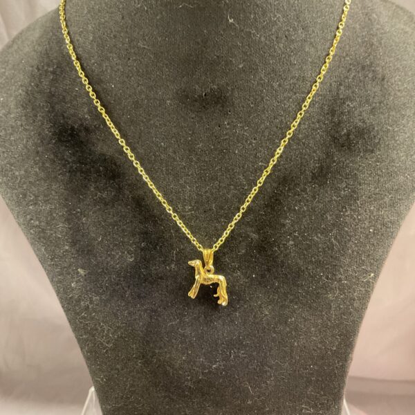 Elegant silver greyhound pendant necklace on a chain.