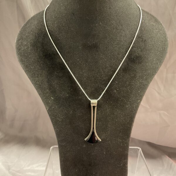 Vintage silver modernist pendant necklace on a snakelink chain.