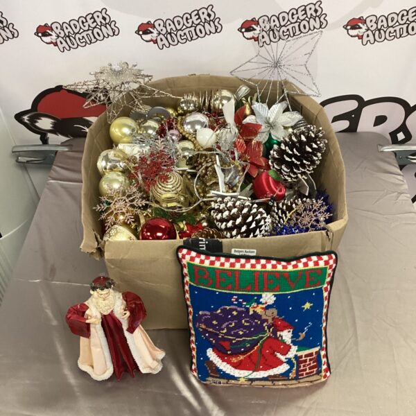 A box full of colourful vintage Christmas tree decorations.