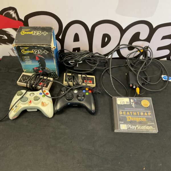 Lot of retro and modern game controllers, including NES and Xbox.