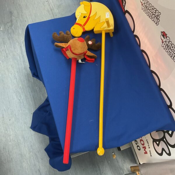 Vintage wooden hobby horse with reindeer head, a charming collectible toy.