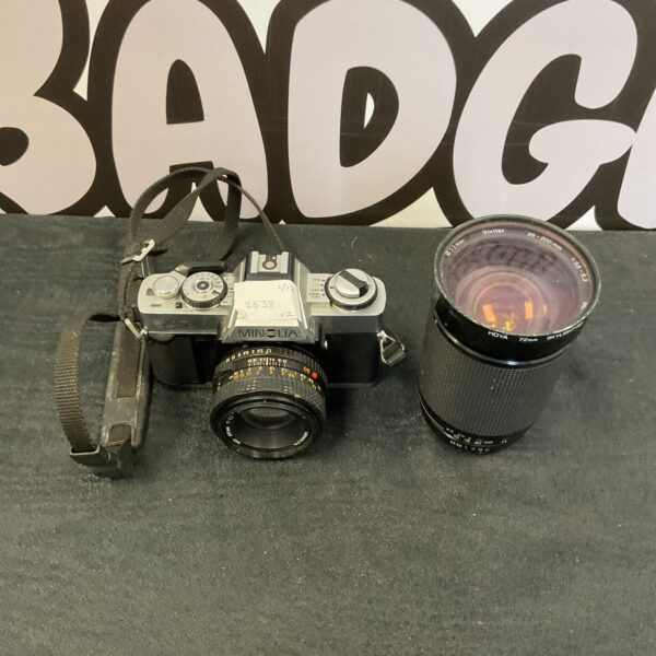Vintage Minolta XG-1 camera with Vivitar lens for film photography.