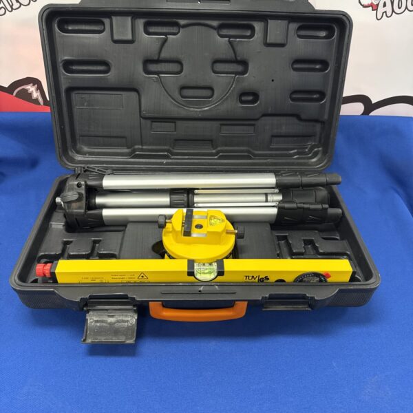 Used laser level kit with tripod and carrying case for construction.