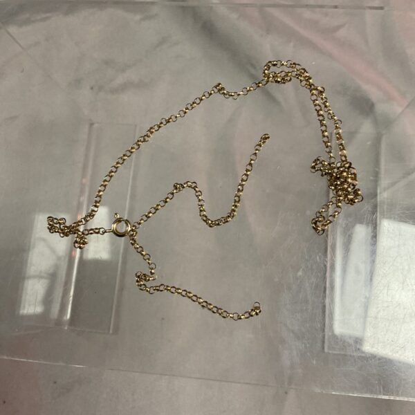 Close-up of 9ct gold scrap chain necklace for melting or repair.