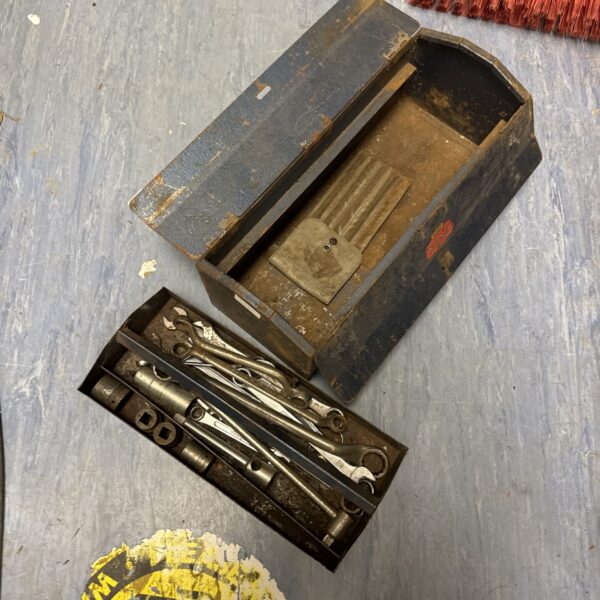 Vintage Enox metal toolbox with wrenches inside, antique tool storage.
