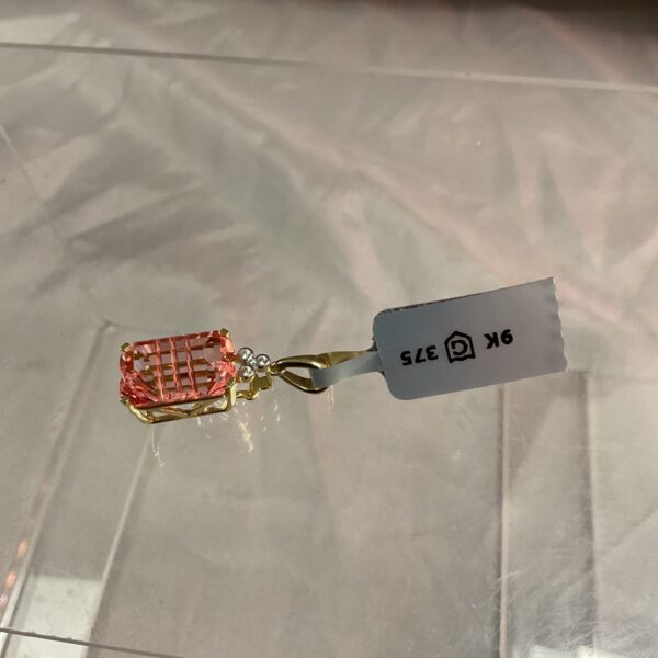 Vintage 9ct gold pendant with vibrant tourmaline gemstone.