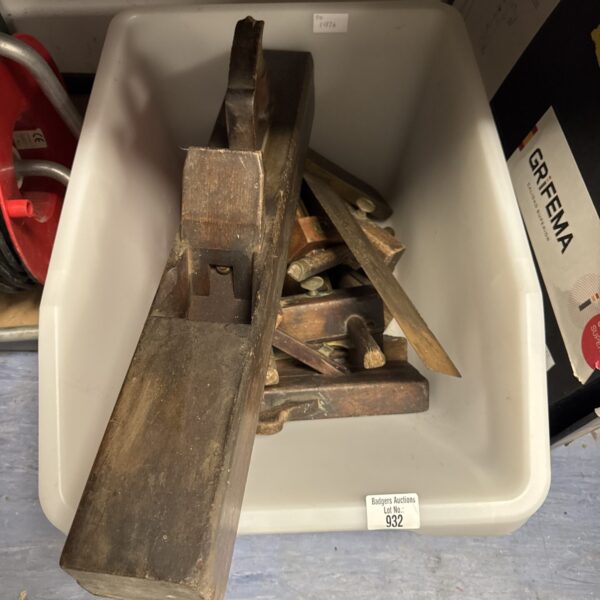 Vintage woodworking tools lot including hand planes and carpentry implements.