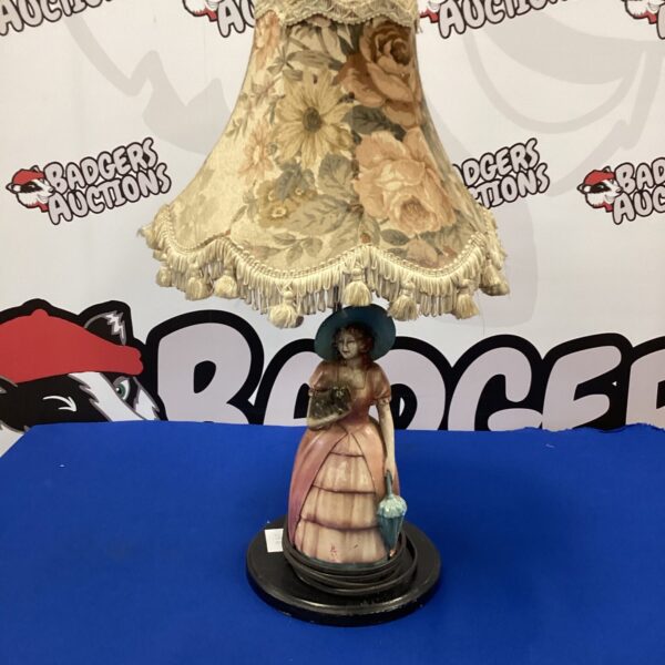 Vintage table lamp with lady and dog sculpture, retro kitsch lighting.
