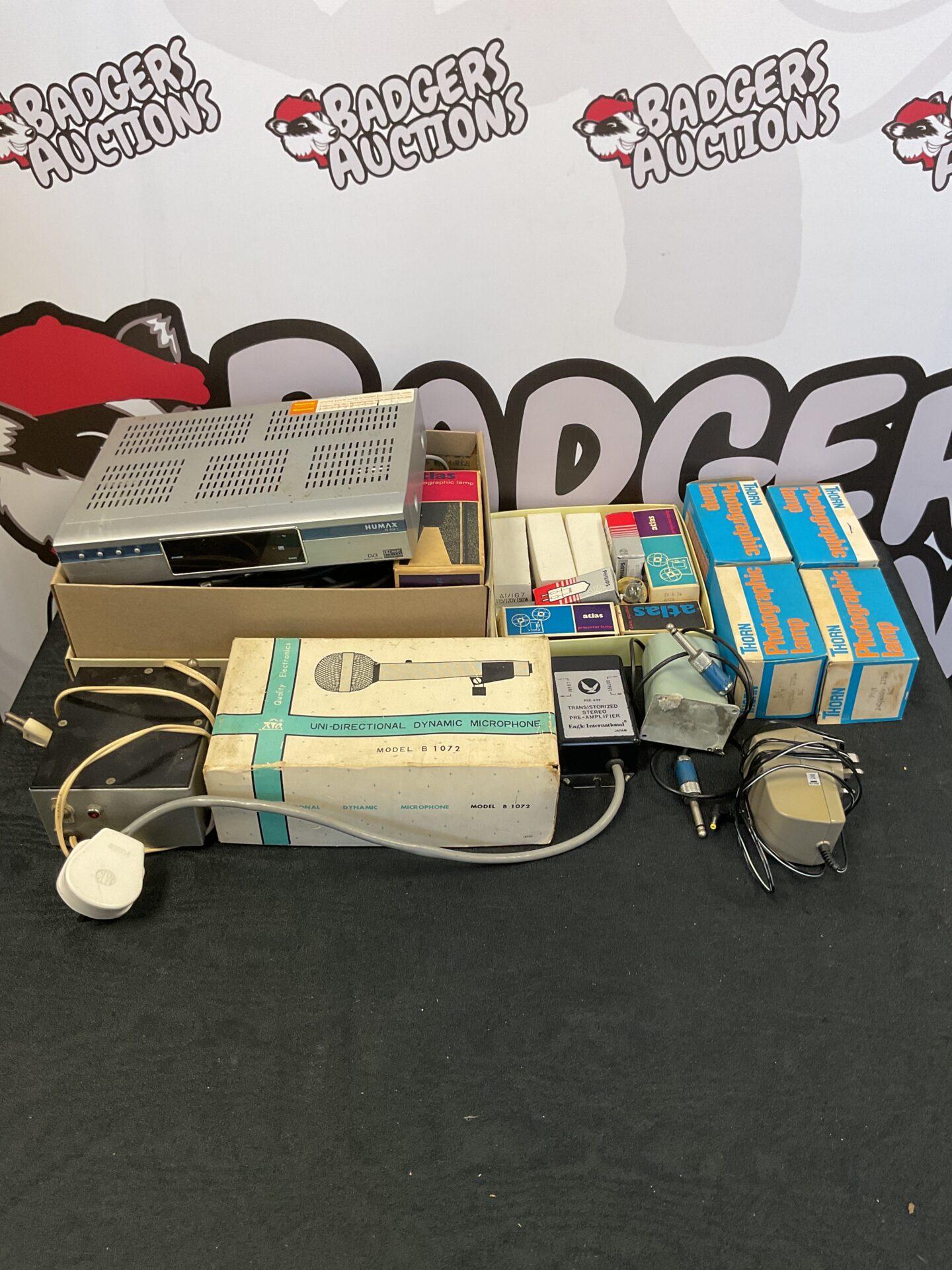 217 Box of various electricals including Humax MPEG2 player, vintage mic and various photographic lights
