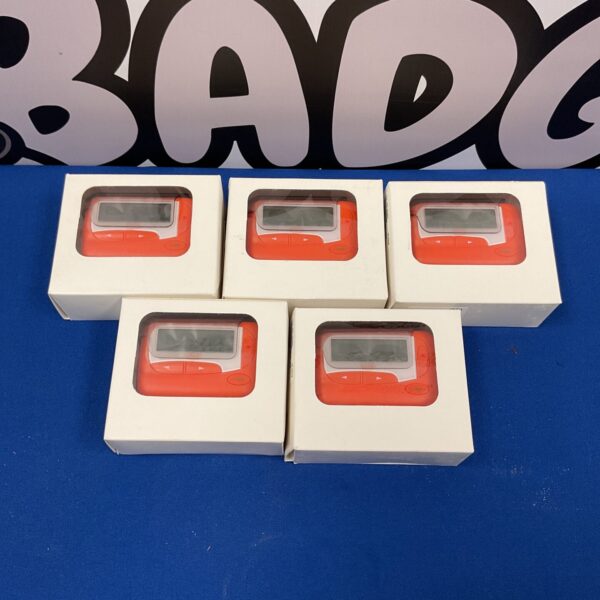 Five vintage EZ-2028 mobile pagers in boxes.
