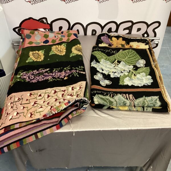 Vintage floral tapestries with colourful patterns displayed indoors.