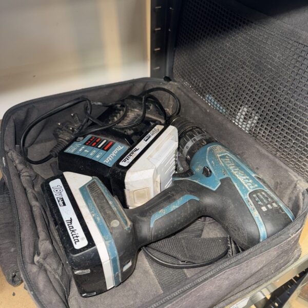Makita cordless drill with batteries and charger, ideal for DIY projects.