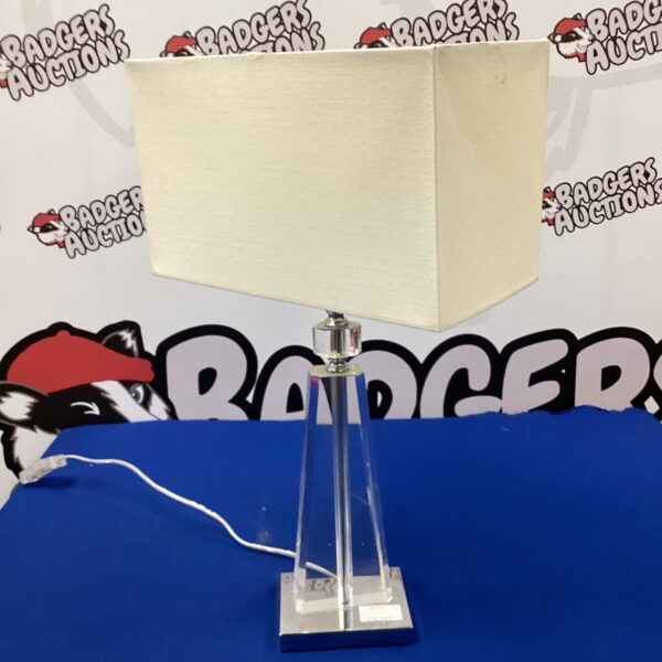 Clear glass geometric table lamp for desk or accent lighting.