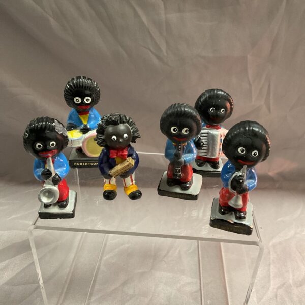 Vintage Robertson jazz band figures playing instruments.