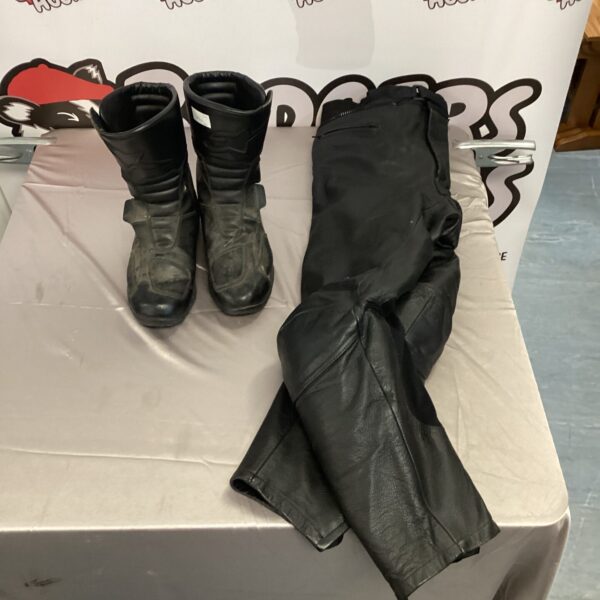 Alpine Star motorcycle boots and leather trousers set for riders.