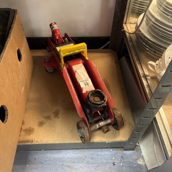 Used 2 tonne trolley jack with long pole for automotive lifting.