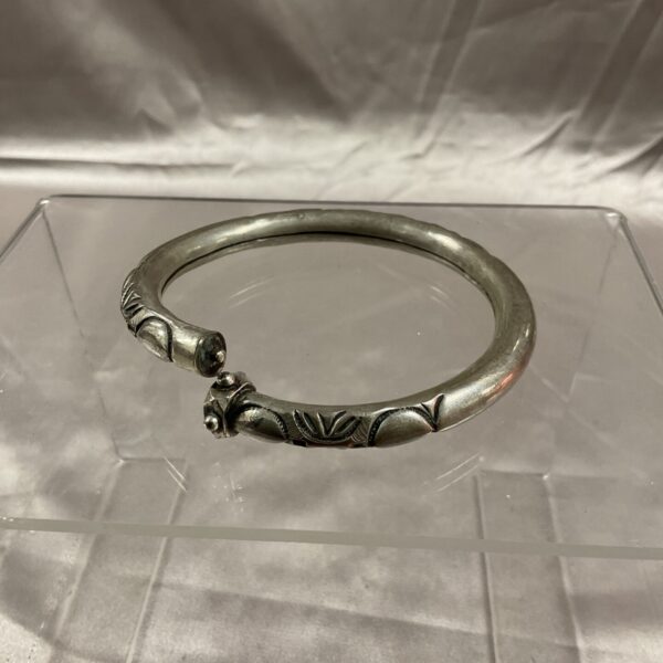 Intricate silver relief decorated bracelet, antique jewellery.
