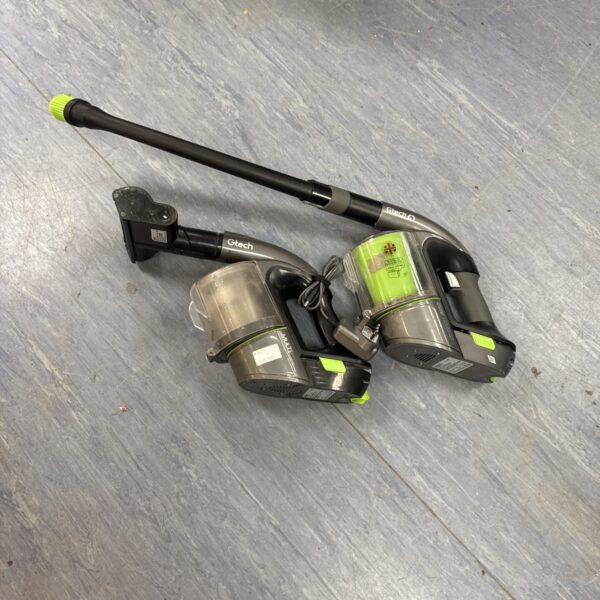 Pair of Gtech cordless hoovers for home cleaning, untested condition.