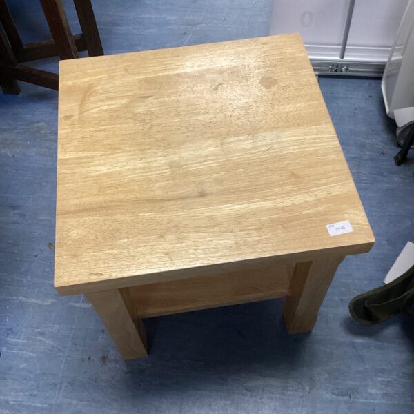 Small wooden side table with a square top and four legs.
