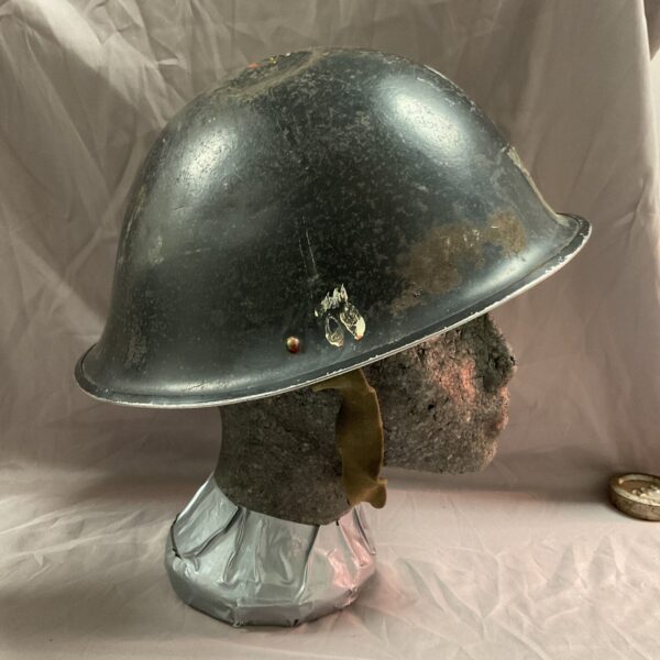 Side view of a British Mk3 Turtle helmet, Falklands War era.