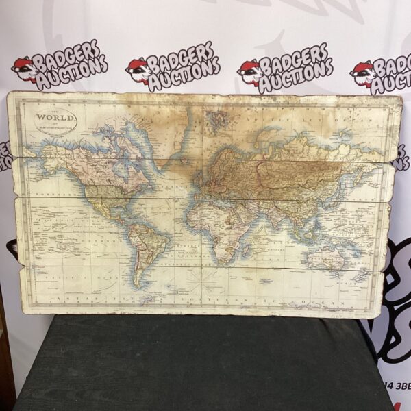 Detailed vintage world map on a four-panel board.