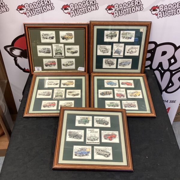 Framed collection of vintage Land Rover collectors cards for enthusiasts.