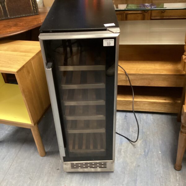 Black countertop wine chiller with stainless steel door.