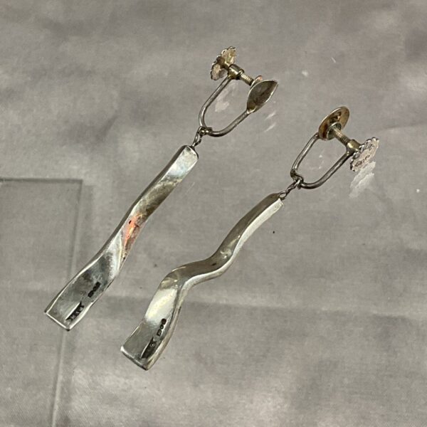Hallmarked sterling silver drop earrings with delicate dangle.