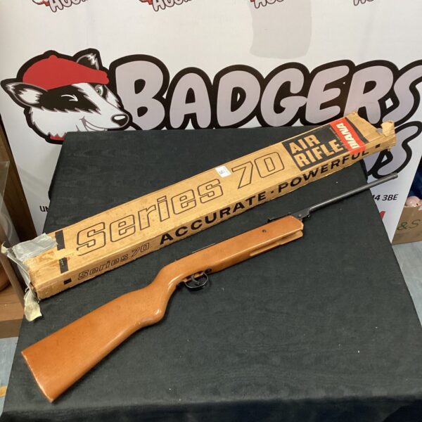 Vintage Diana Series 70 .177 air rifle with wooden stock.