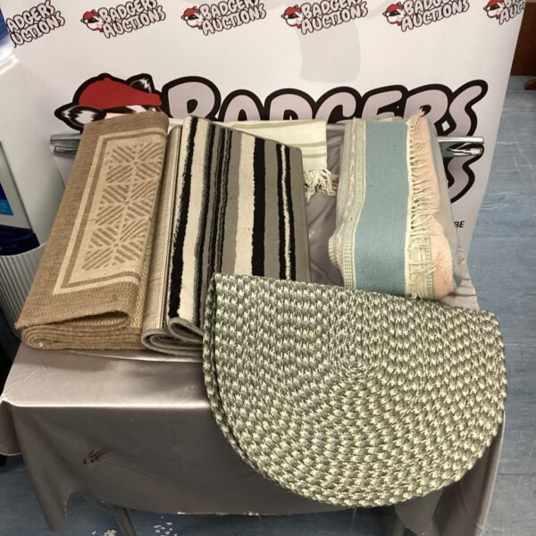 Lot of five vintage rugs with patterned designs.